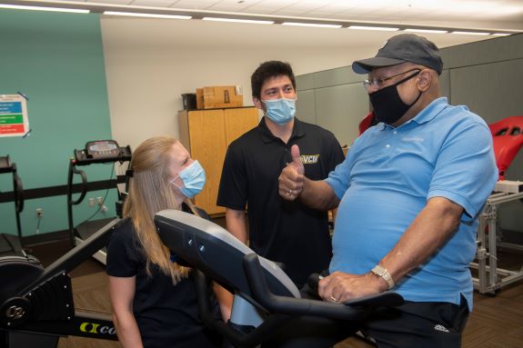 John Smith with his exercise coaches