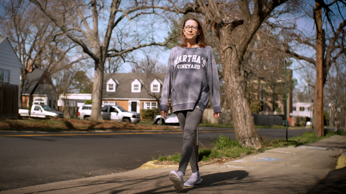 woman walking in neighborhood