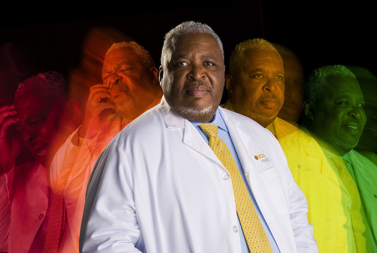 Dr. Wally Smith in his white coat with different versions of himself in the background