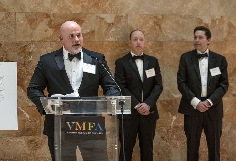 Michael Roussos speaking to event attendees