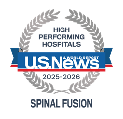 An emblem for U.S. News and World Report's award for High-Performing Hospitals in Spinal Fusion.