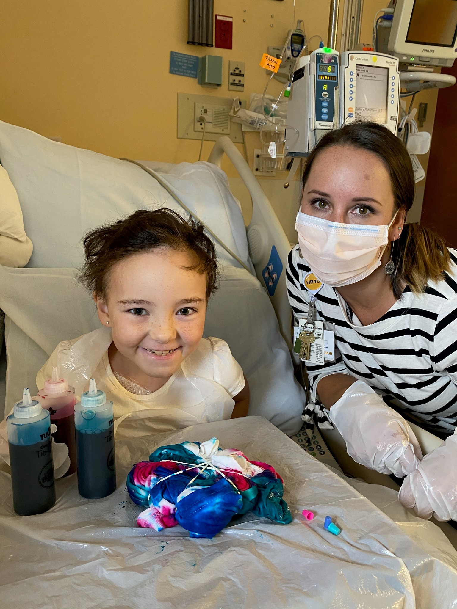 Arts Coordinator with pediatric patient, 2021