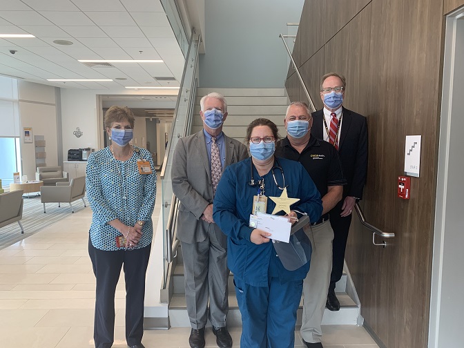 CMH team members standing with Shelly Parham