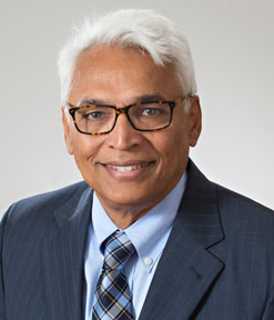 Portrait of Saleem I. Naviwala, MD, in a black, business suit.