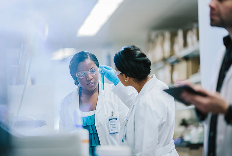 Two researchers work in the lab