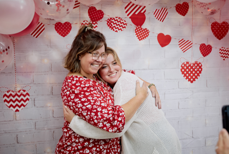 Pauley social worker Megan Maltby hugs an attendee of the first annual Heart-a-versary.