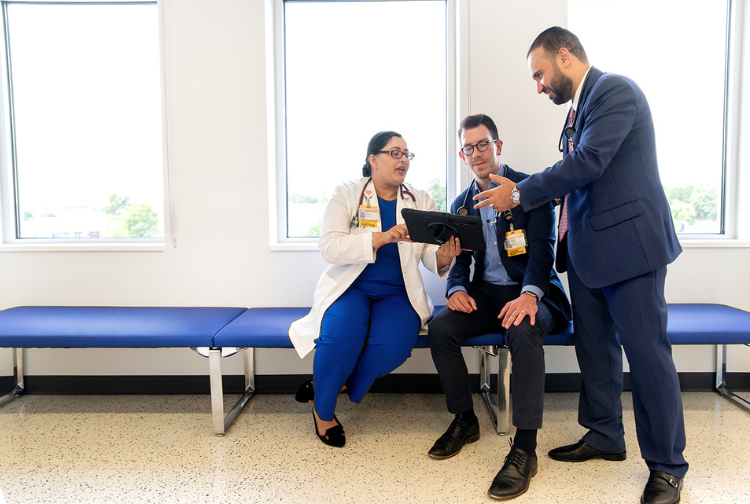 Three Pauley Heart cardiologists discuss a medical issue.
